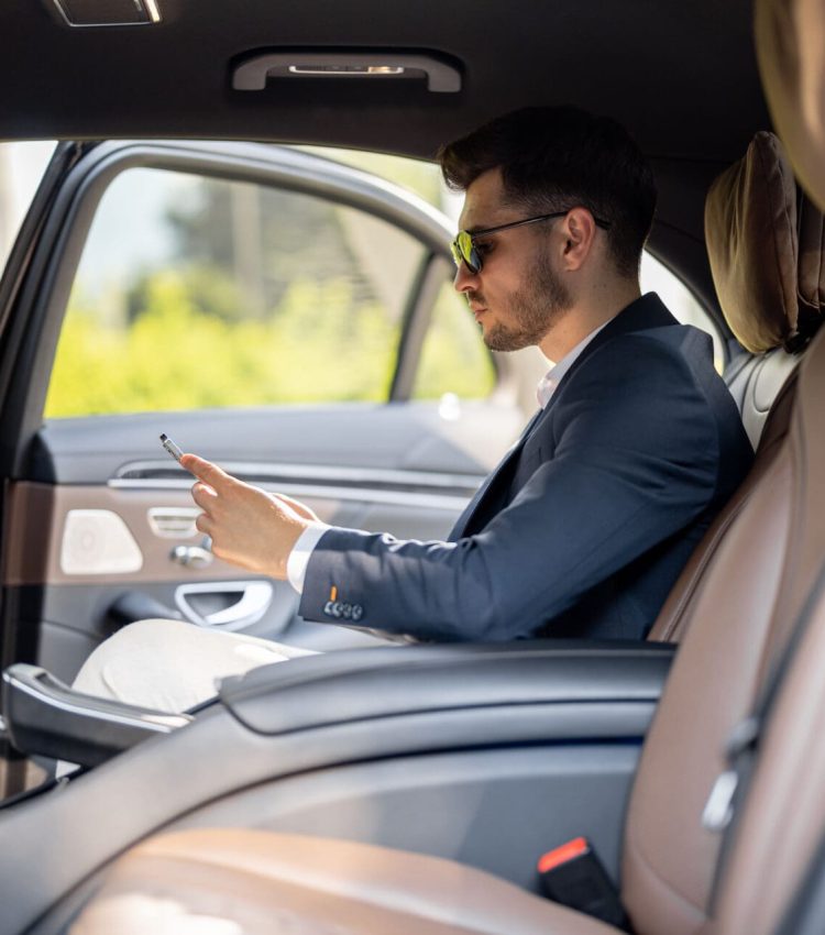 business man in car using mobile device 2026 03 24 13 03 19 utc