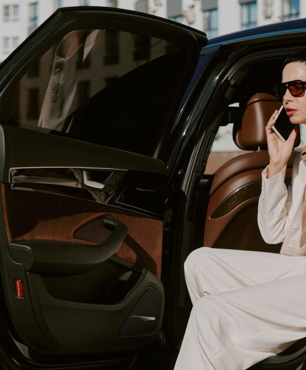 stylish woman in white suit in car 2026 03 26 23 23 45 utc