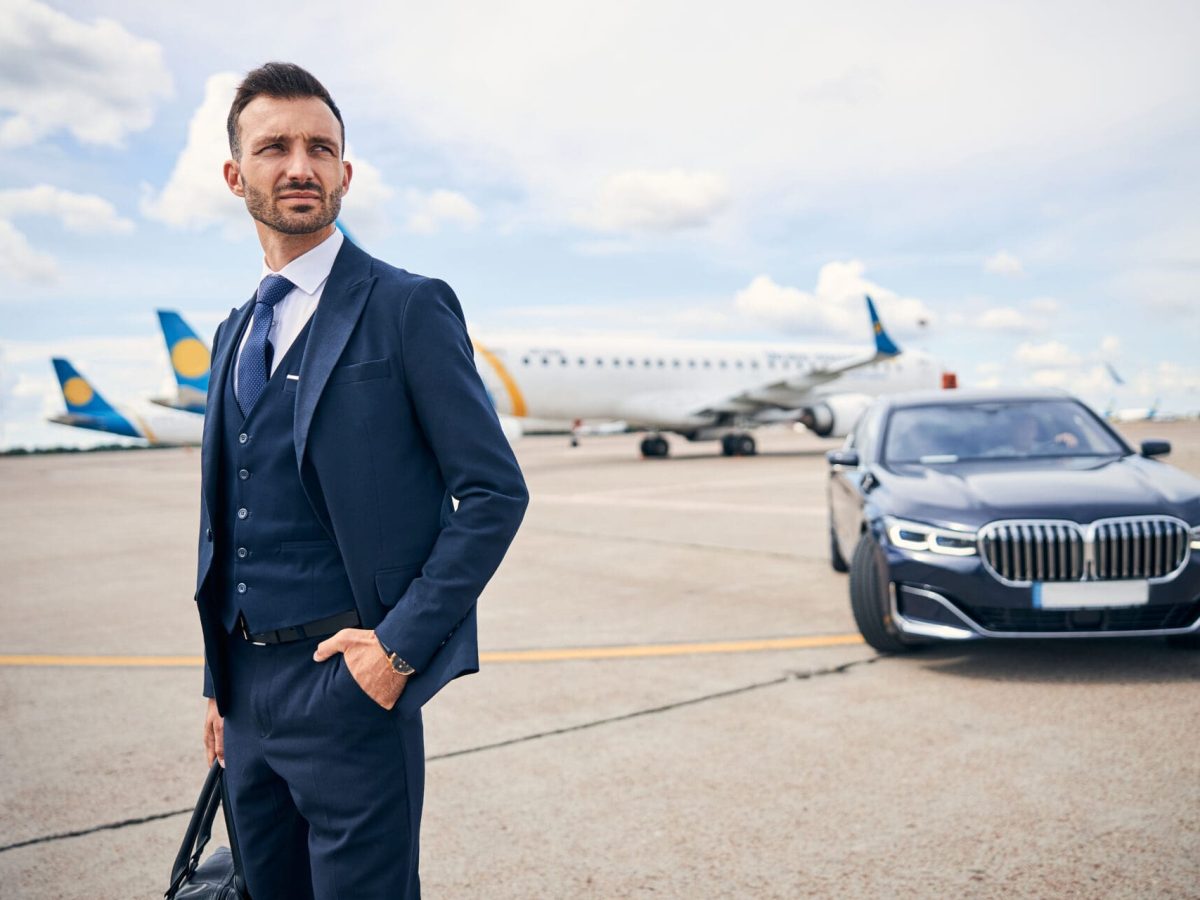 well dressed man waits on airport tarmac 2026 03 10 03 57 18 utc
